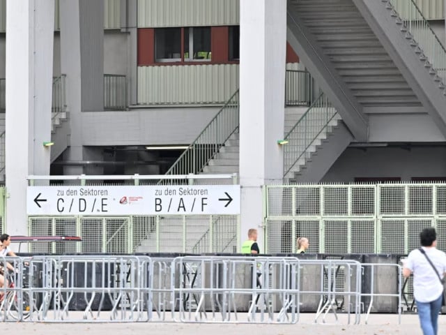 people and security walk outside happel stadium after taylor swift s three concerts this week were canceled after the government confirmed a planned attack at the stadium in vienna austria august 8 2024 photo reuters